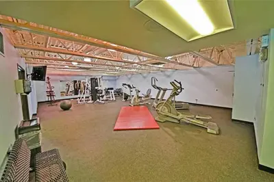 a gym with exercise equipment in the middle of a room at Snowblaze Condominiums C14 in Winter Park