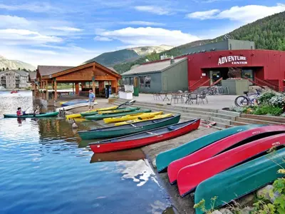a bunch of boats are lined up on the water at 1538 Lakeshore condo in Dillon