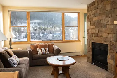 a living room with a couch and a fireplace at 1538 Lakeshore condo in Dillon