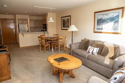 a living room with a couch and a table at 1538 Lakeshore condo in Dillon