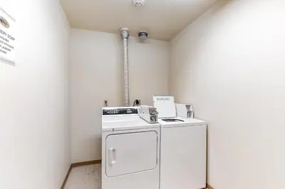 a laundry room with a washer and dryer at Zephyr Mountain Ski-In Ski-Out Condo in Winter Park