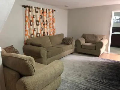 a living room with two couches and a couch and chairs at MileHi Vacation Home Pet Friendly in Aurora