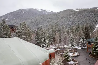 an aerial view of a resort with snow covered trees at 8282 Silver Mill condo in Keystone