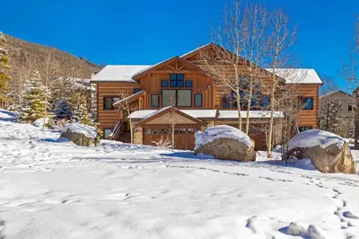 a log cabin in the snow with snow at The Sanctuary Getaway - 192 home in Keystone