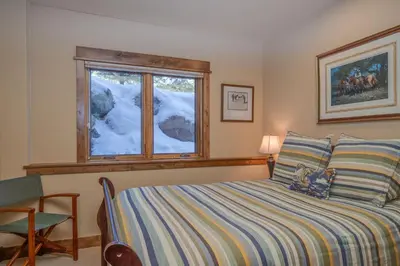 a bedroom with a bed and a window at The Sanctuary Getaway - 192 home in Keystone