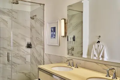 a bathroom with a sink and a shower at The Crawford Hotel in Denver