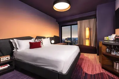 a hotel room with a large bed and a window at The Rally Hotel at McGregor Square in Denver