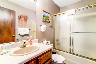 a bathroom with a sink and a shower at Granby Condo with Views in Granby
