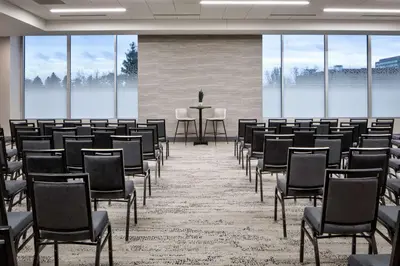 a room with rows of chairs and a table at Hyatt House Denver Aurora Anschutz Medical Campus in Aurora
