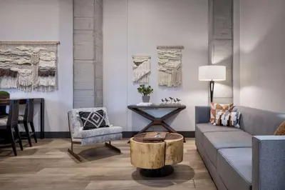 a living room with a couch and a chair and a table at Hyatt House Denver Aurora Anschutz Medical Campus in Aurora
