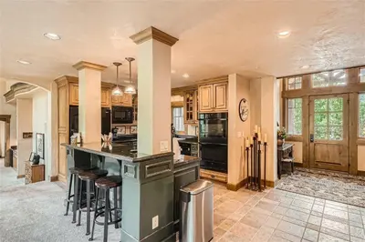 a large kitchen with an island in a house at Keystone Gulch Estate 1688 estate in Keystone