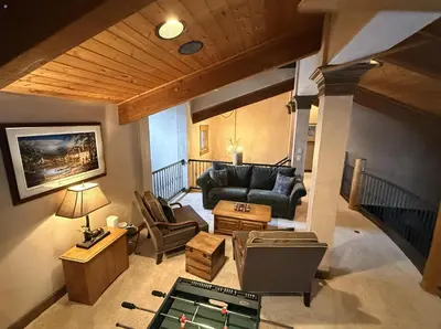 a living room with a couch and a table at Keystone Gulch Estate 1688 estate in Keystone