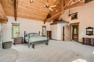 a bedroom with a bed and a wooden ceiling at Keystone Gulch Estate 1688 estate in Keystone