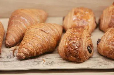 a group of croissants and pastries on a plate at Clayton Hotel & Members Club in Denver