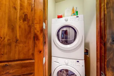 a white washer and dryer in a room at Base Camp 496 in Winter Park