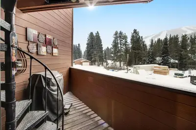 a balcony with a view of a snowy mountain at Winter Park Place 14 in Winter Park