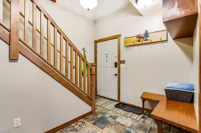 a home office with a staircase and a desk at Winter Park Place 14 in Winter Park