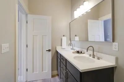 a bathroom with a sink and a mirror at Willows at Grand Park home in Fraser