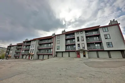 a large apartment building with a lot of windows at Timber Run Evergreen 9 in Winter Park