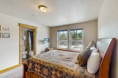 a bedroom with a bed and a window at Arrowhead 31 in Fraser