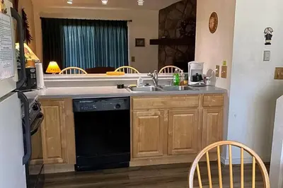 a kitchen with a sink and a dishwasher at MeadowRidge 13-04 in Fraser