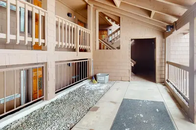 a hallway of a building with stairs and a tunnel at Timber Run Vista 2 in Winter Park