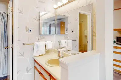 a bathroom with a sink and a mirror at Timber Run Vista 2 in Winter Park