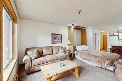 a living room with a couch and a coffee table at Snowblaze Condominiums E103 in Winter Park