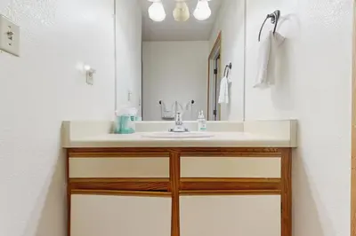 a bathroom with a sink and a mirror at Snowblaze Condominiums E103 in Winter Park