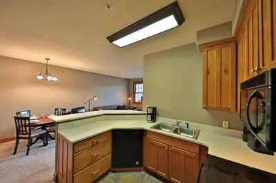 a kitchen with a sink and a counter top at Kicking Horse Lodges 3-202 in Granby
