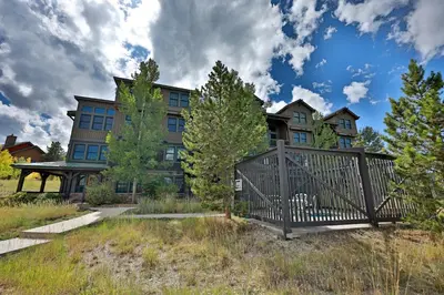 a house with a gate in front of it at Kicking Horse Lodges 4-205 in Granby