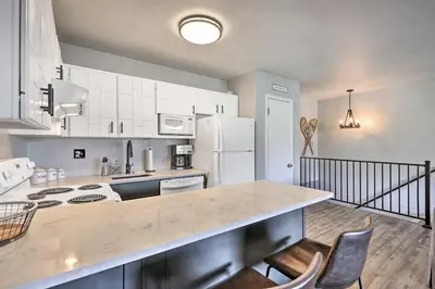 a kitchen with white cabinets and a counter top at 7 Mi to Keystone Mtn-View Abode with Deck! in Dillon