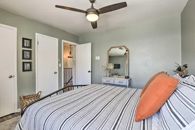 a bedroom with a bed and a ceiling fan at 7 Mi to Keystone Mtn-View Abode with Deck! in Dillon