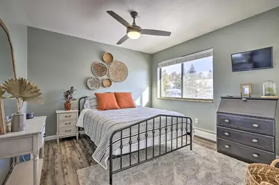 a bedroom with a bed and a ceiling fan at 7 Mi to Keystone Mtn-View Abode with Deck! in Dillon