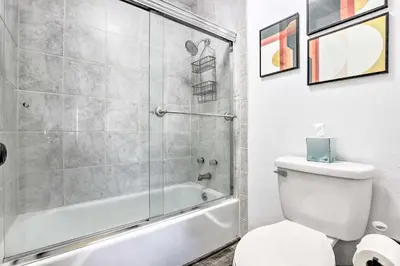 a bathroom with a shower and a toilet and a tub at 7 Mi to Keystone Mtn-View Abode with Deck! in Dillon