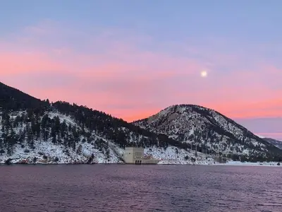 a view of a mountain with the moon in the sky at Tranquility On The River Three -- EV #6042 townhouse in Estes Park