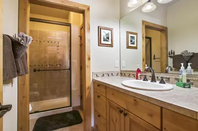 a bathroom with a sink and a shower at Tranquility On The River Four -- EV #6041 townhouse in Estes Park