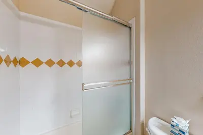a shower with a glass door in a bathroom at Blue River Townhome Unit D6 in Silverthorne