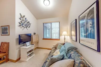 a living room with a couch and a tv at Blue River Townhome Unit D6 in Silverthorne