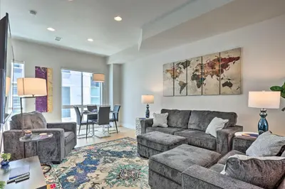 a living room with a couch and a table at Trendy Denver Townhome - Walk to Mile High Stadium in Denver