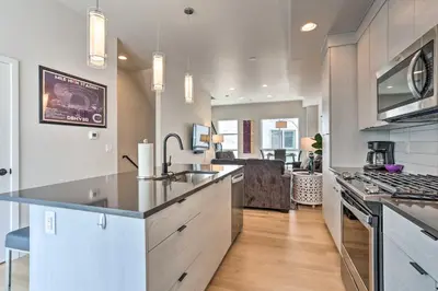 a kitchen with a sink and a counter top at Trendy Denver Townhome - Walk to Mile High Stadium in Denver