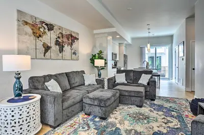a living room with a couch and a table at Trendy Denver Townhome - Walk to Mile High Stadium in Denver