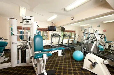 a gym with treadmills and cardio machines at Gateway Mountain Lodge, A Vail Resorts Property in Keystone