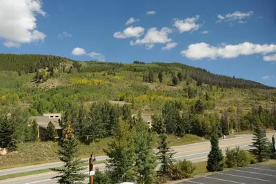 a view of a mountain with trees and a road at Gateway Mountain Lodge, A Vail Resorts Property in Keystone