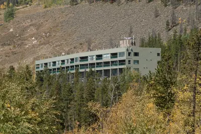a building on the side of a hill at Aspen Ridge Condominiums by Vail Resorts in Keystone