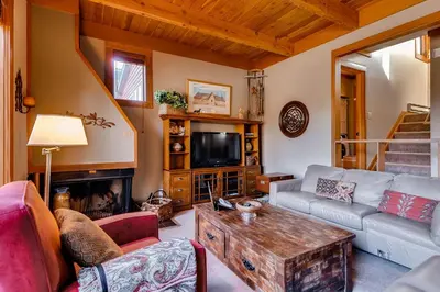 a living room with a couch and a table at Aspen Ridge Condominiums by Vail Resorts in Keystone