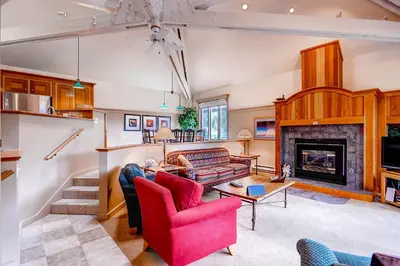 a living room with a couch and a fireplace at Forest Condominiums by Vail Resorts in Keystone