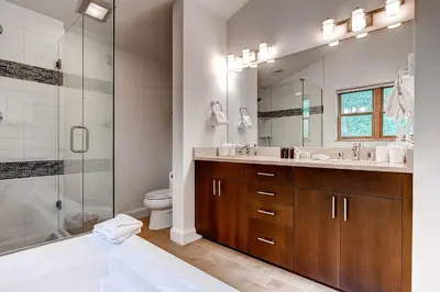 a bathroom with a tub and a sink and a shower at Forest Condominiums by Vail Resorts in Keystone