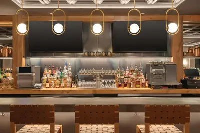 a bar in a restaurant with two lights at The Eddy Taproom & Hotel in Golden