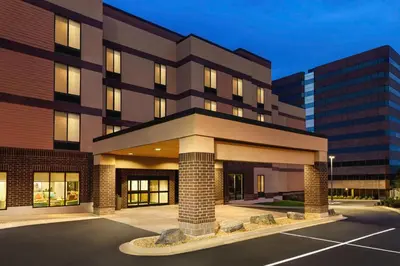 a building with a parking lot in front of it at Home2 Suites by Hilton Denver West / Federal Center in Lakewood